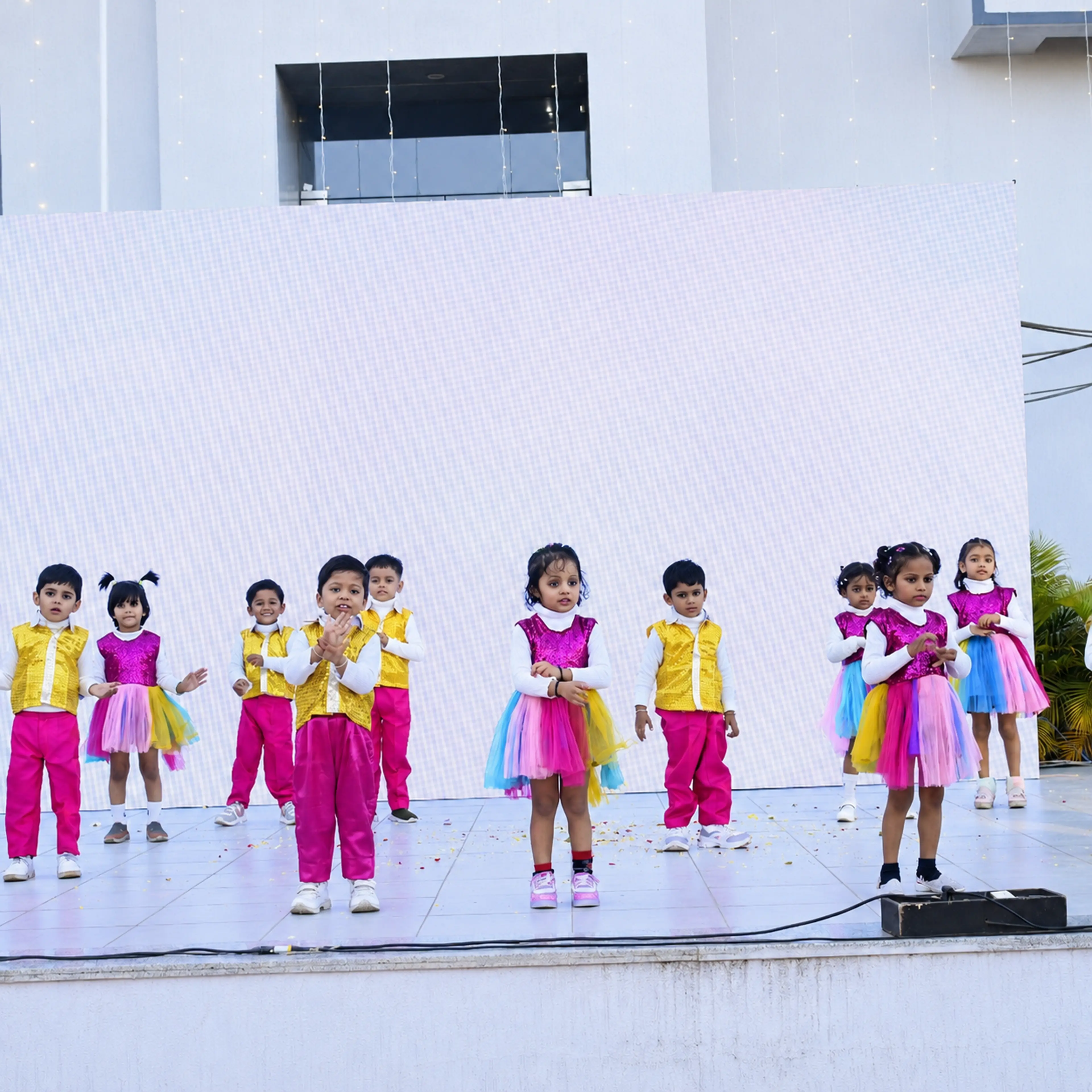 Pre-primary children performing on stage at Gurukul